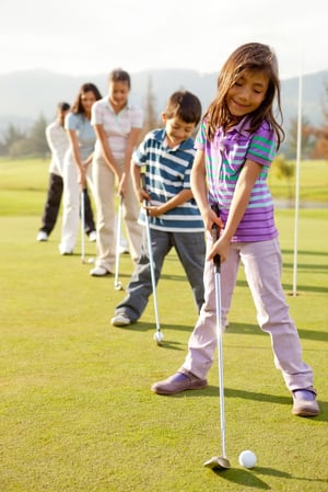 Golf players practicing to hit the ball