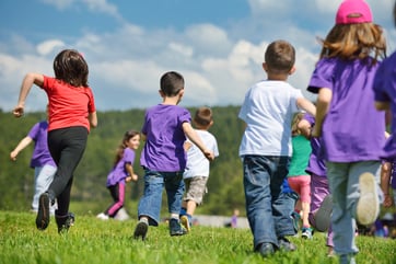 happy kids group have fun in nature outdoors park