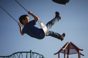 kid swinging