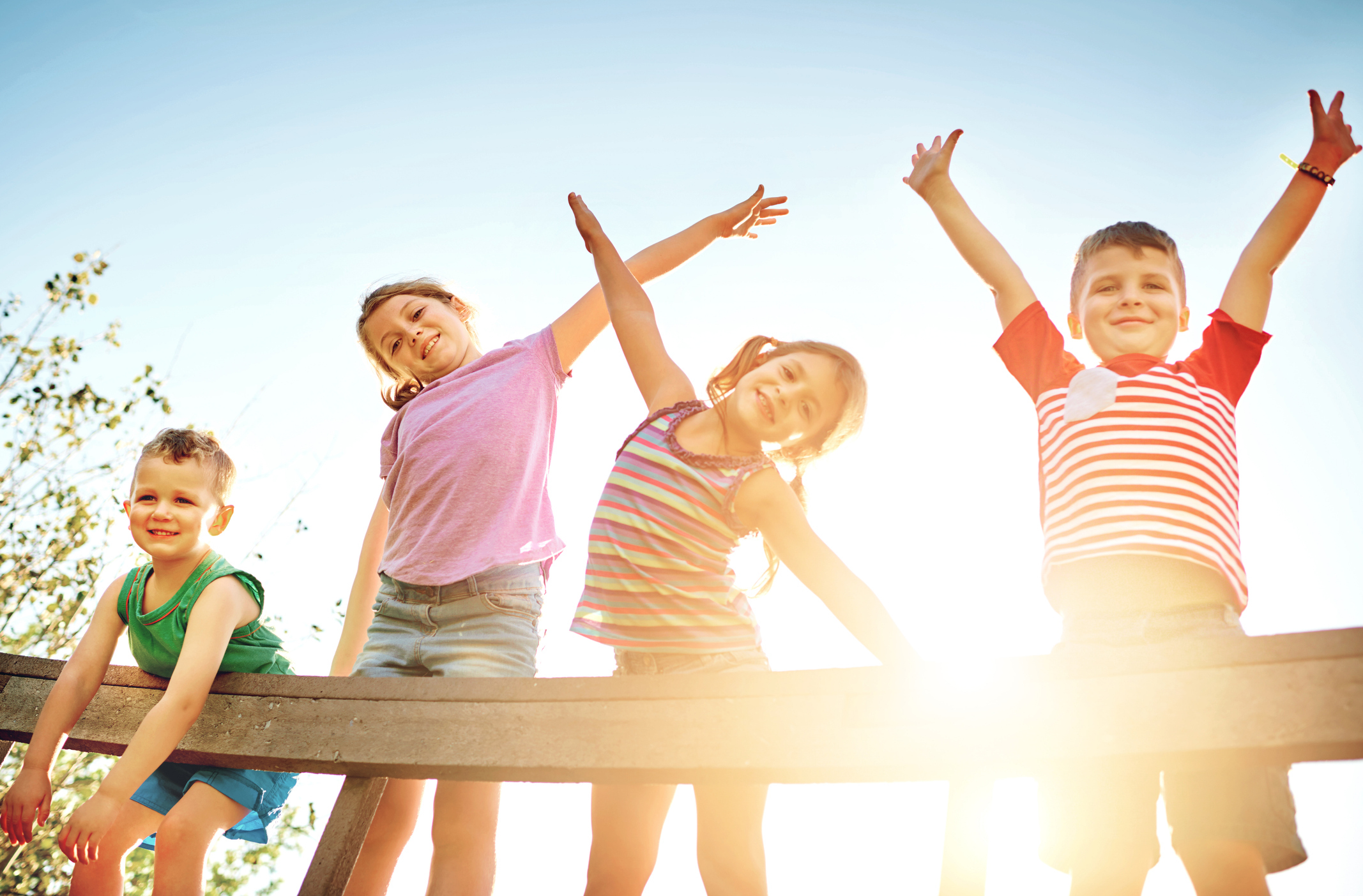 Children playing outside in the sun. 