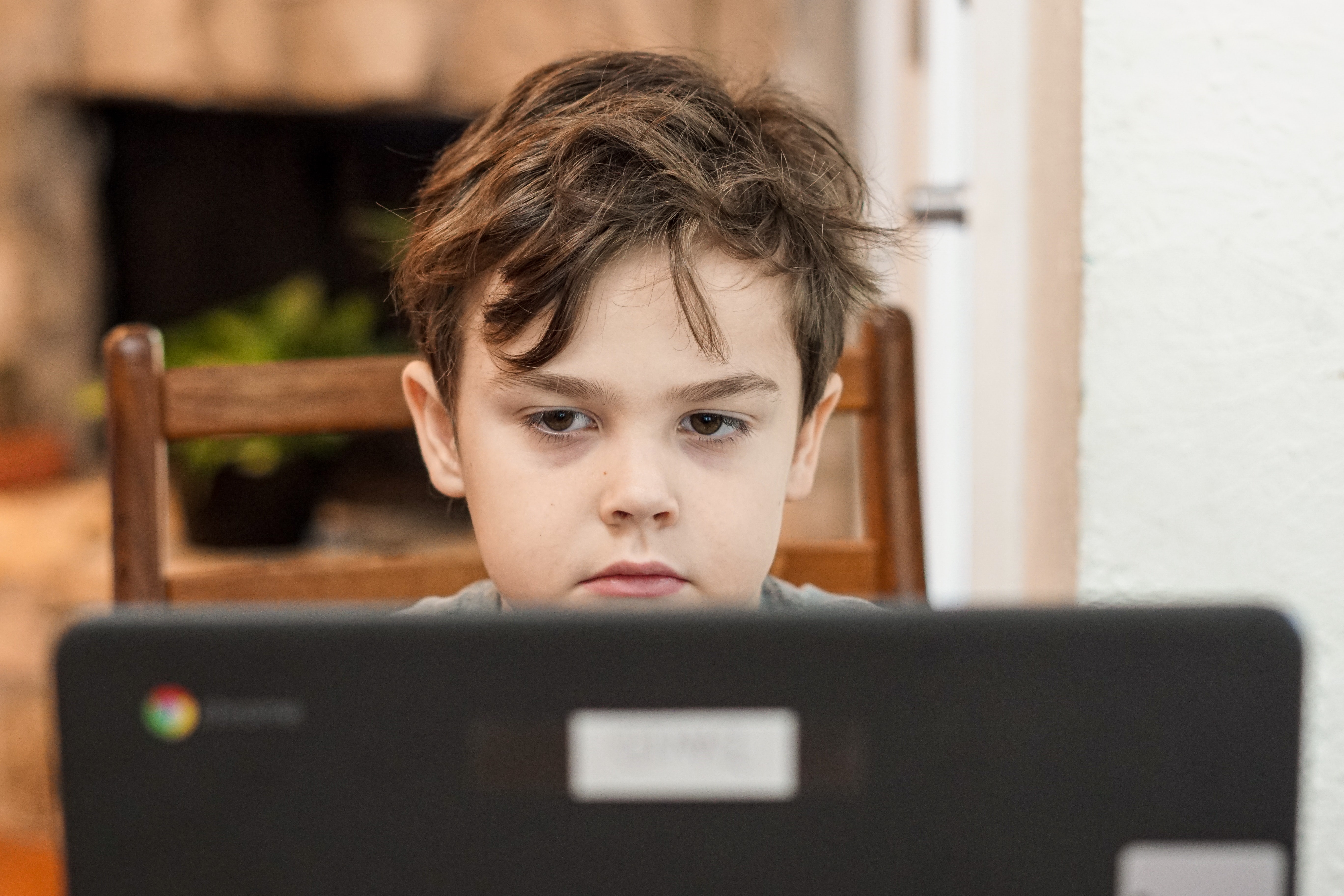 May Recreation Consequences of Increased Screen Time for Kids During Pandemic Kid Looking Bored at Computer Screen